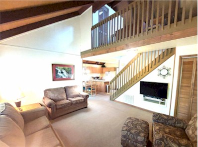 Family Room With High Ceiling And Loft Above